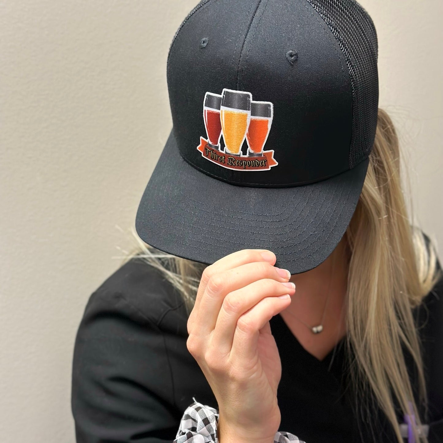 A model wearing our Thirst responder hat