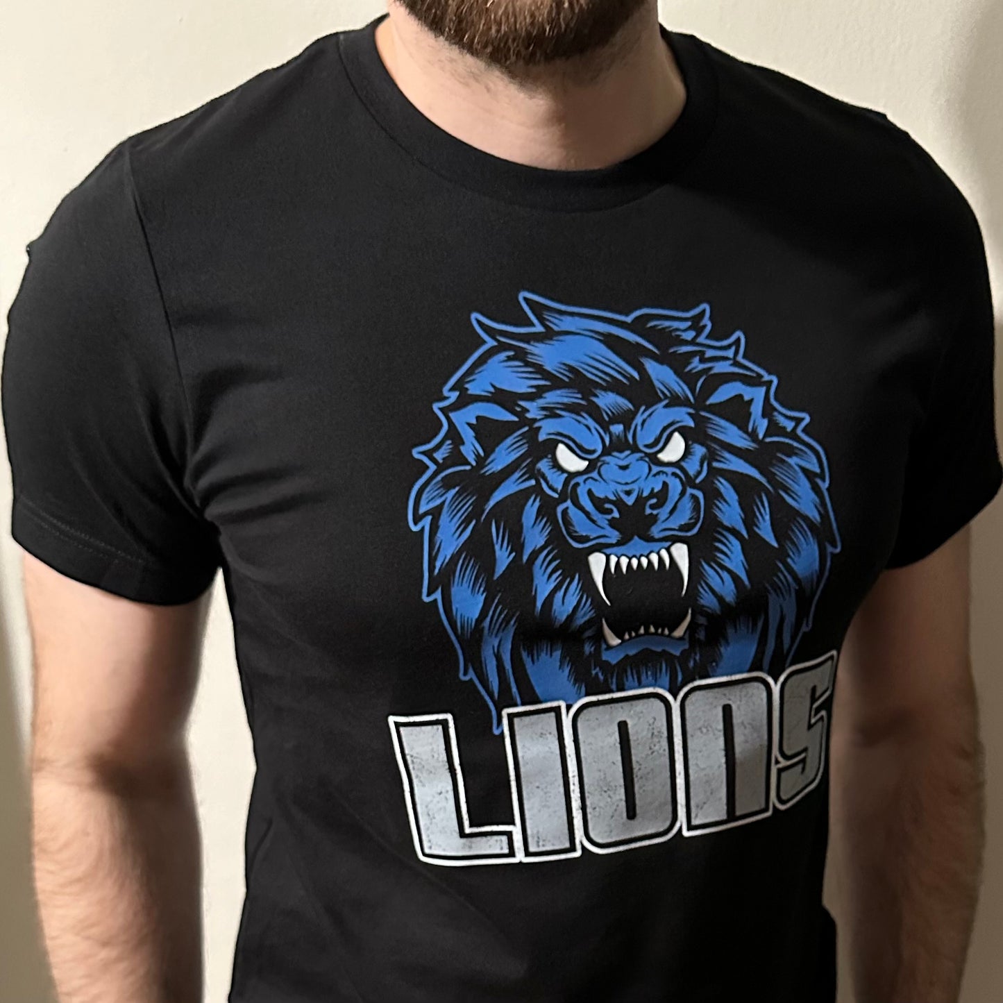 full view of the restore the roar lions shirt on a medium shirt