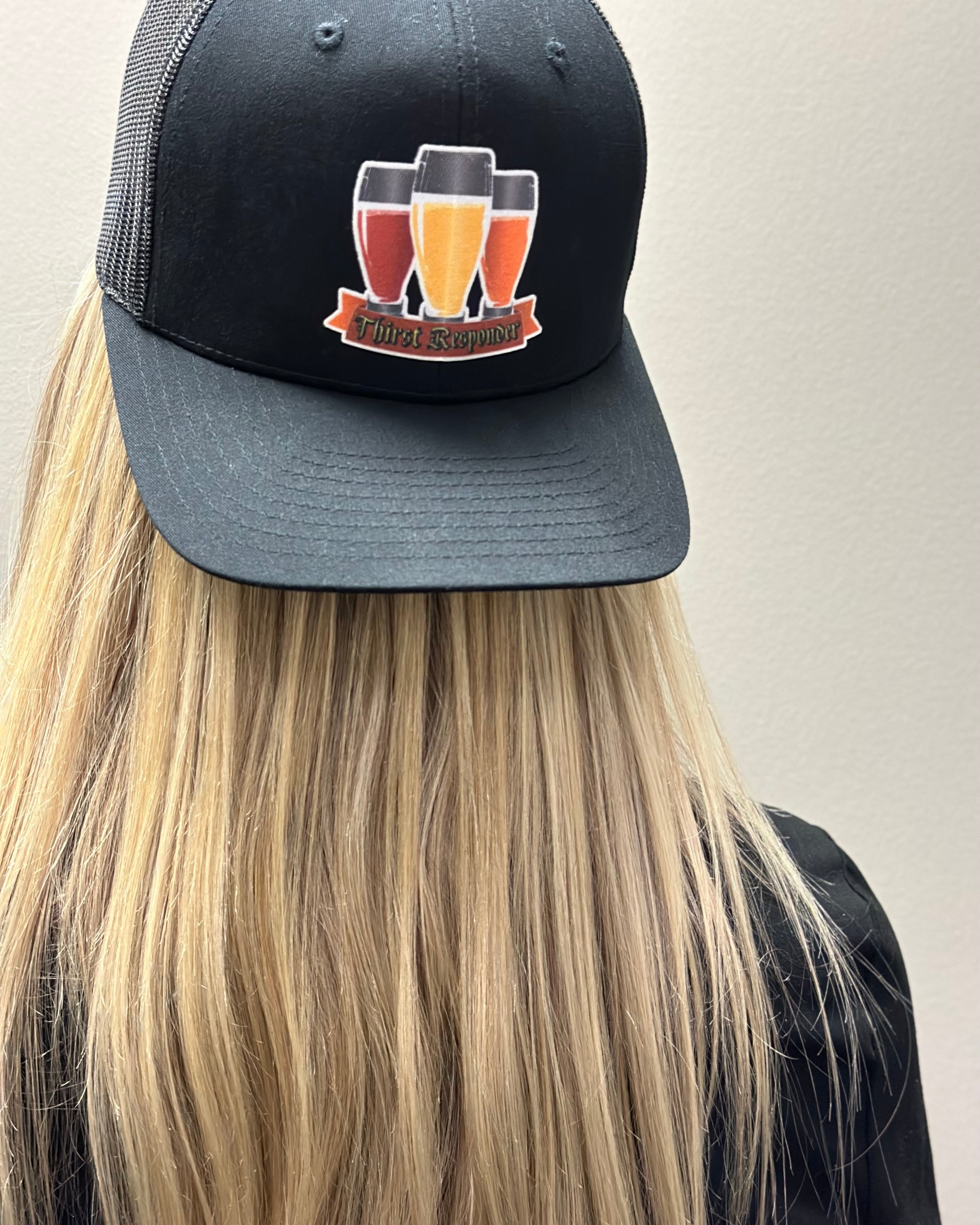 Model wearing a thirst responder hat backwards