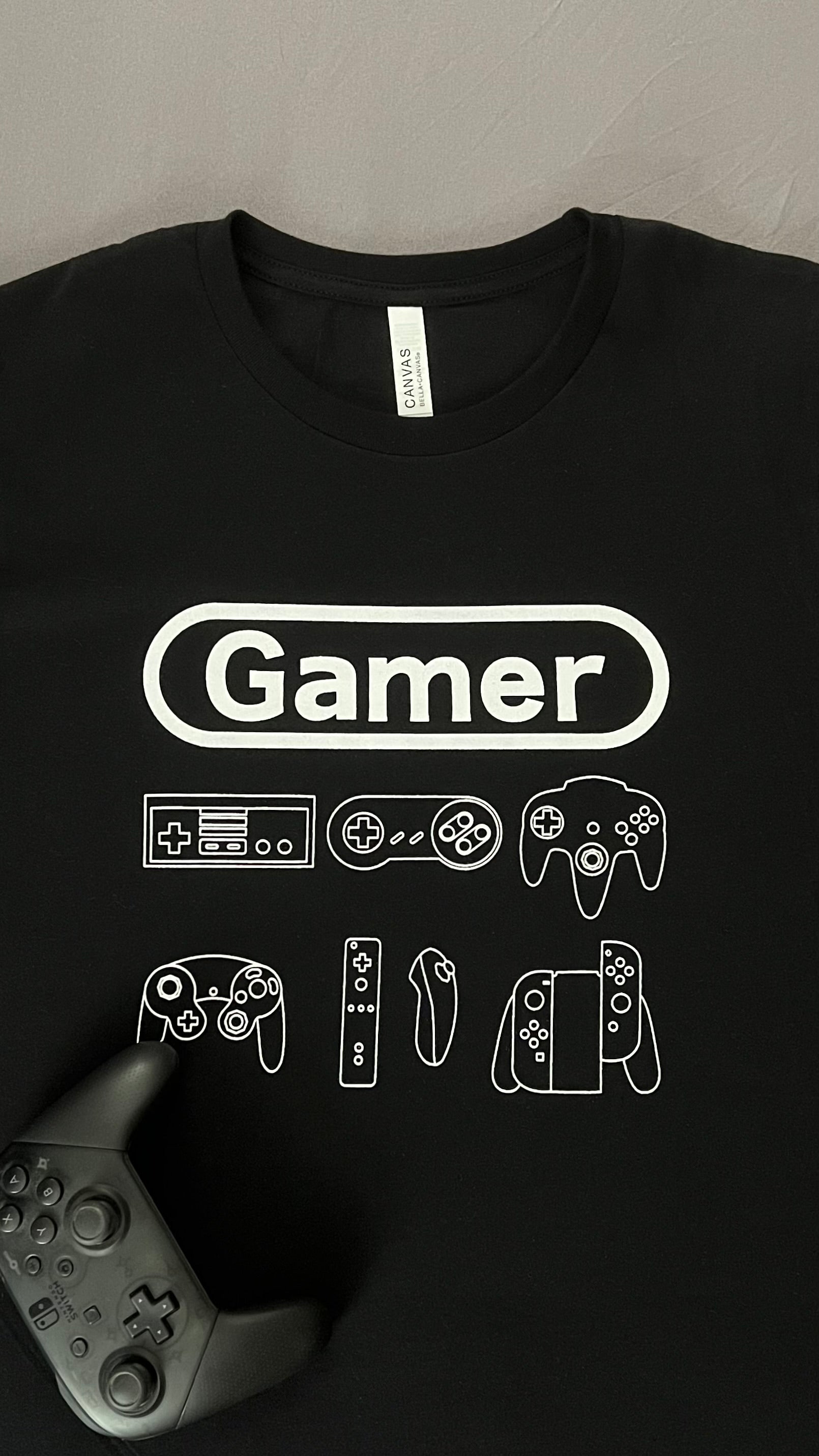Black and white Gamer shirt with a controller to size