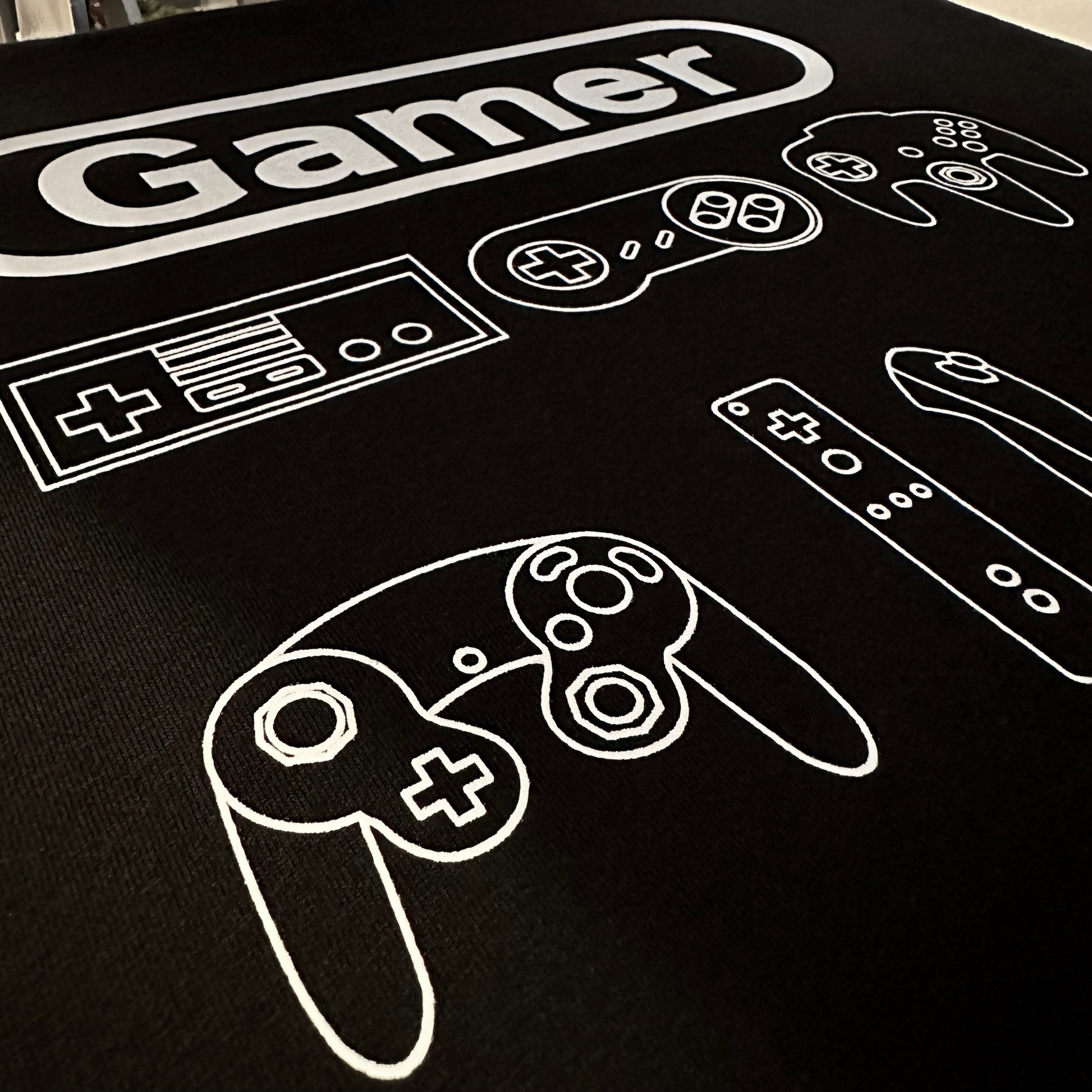 Close up of the black and white gamer shirt